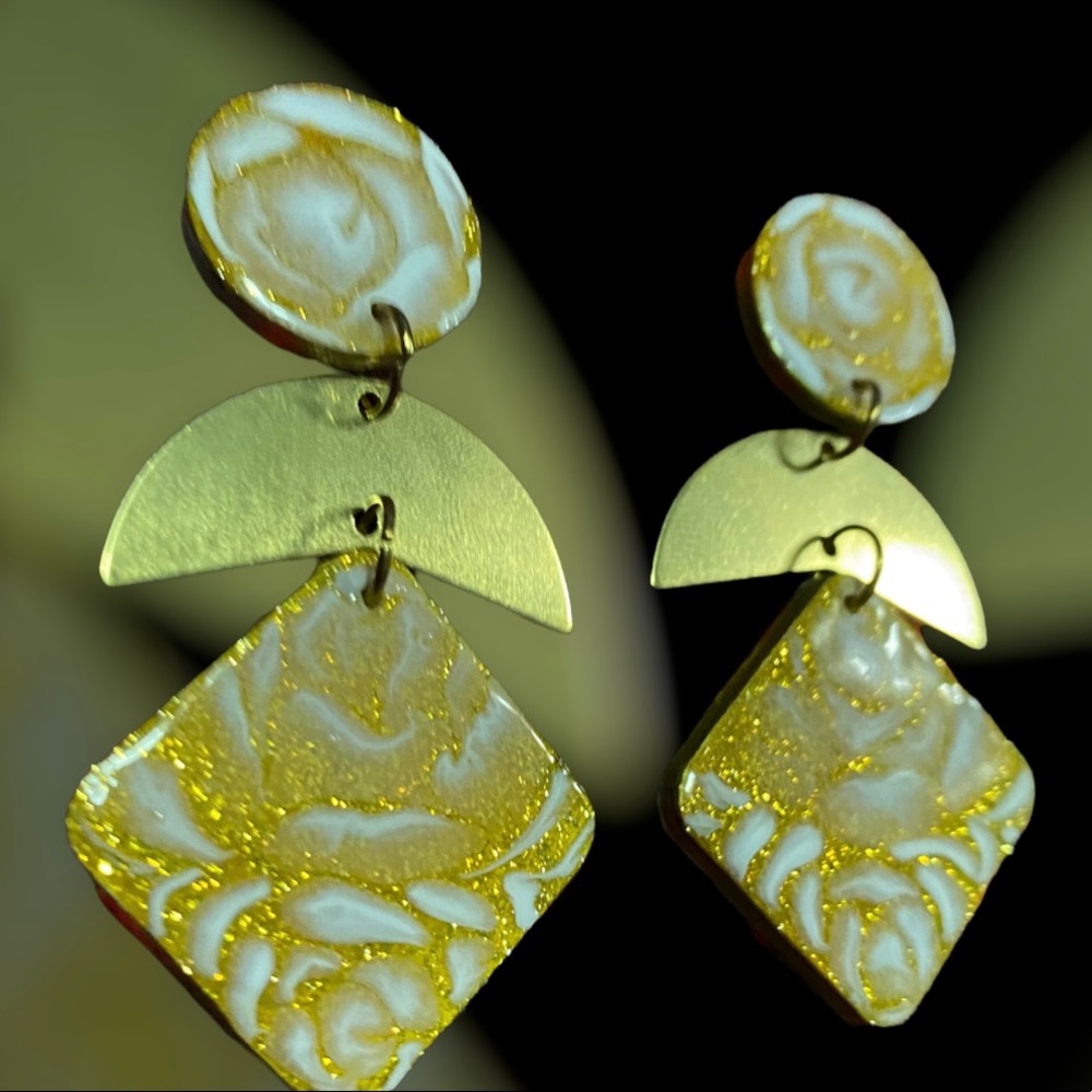 NWOT Handcrafted and hand painted wood earrings. With brass accents.